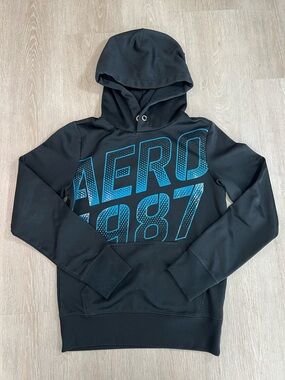 Retro Inspired Black Hoodie with Teal Blue 'AERO 1987' Graphic